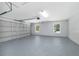 Spacious garage with epoxy flooring, windows, and updated door at 5593 Sw 199Th Ct, Dunnellon, FL 34431