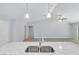 Open-concept kitchen features a granite island with stainless sink, plus pendant lighting at 5593 Sw 199Th Ct, Dunnellon, FL 34431