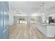 Open-concept living area with natural light and hardwood flooring at 5593 Sw 199Th Ct, Dunnellon, FL 34431