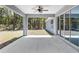 Covered back patio and ceiling fan, perfect for outdoor entertaining and relaxation at 5593 Sw 199Th Ct, Dunnellon, FL 34431