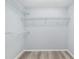 Walk-in closet with wood-look floors and multiple wire shelves for storage at 5593 Sw 199Th Ct, Dunnellon, FL 34431
