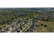 Aerial view of a residential neighborhood with houses near lakes and a wooded area at 1991 Sanderlin Point Loop, Apopka, FL 32703