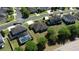 Aerial view of suburban homes with a screened-in pool in a fenced backyard at 1991 Sanderlin Point Loop, Apopka, FL 32703