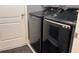 Modern laundry room features a new Samsung washer and dryer with sleek gray finish at 1991 Sanderlin Point Loop, Apopka, FL 32703