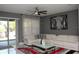 Comfortable living room featuring a plush white sectional sofa, stylish rug, and sliding glass doors to the exterior at 1991 Sanderlin Point Loop, Apopka, FL 32703