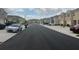 A street lined with newly built townhouses, showcasing the community's layout and design at 1026 Lido Dr, Howey In The Hills, FL 34737