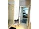 Bright bathroom with a glass enclosed shower and decorative stool seating at 424 Luna Bella Ln # 330, New Smyrna Beach, FL 32168