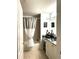 Bathroom featuring neutral tones, granite countertop vanity and shower/bath combination at 424 Luna Bella Ln # 330, New Smyrna Beach, FL 32168