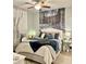 Serene bedroom featuring a plush bed with stylish decor and winter forest wall art at 424 Luna Bella Ln # 330, New Smyrna Beach, FL 32168
