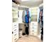 Spacious walk-in closet with custom shelves and drawers, offering plenty of storage space at 424 Luna Bella Ln # 330, New Smyrna Beach, FL 32168