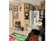 Den with wood-look flooring, sports memorabilia, and framed art at 424 Luna Bella Ln # 330, New Smyrna Beach, FL 32168