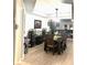 Dining room featuring dark wood furniture, wine storage, and an open layout at 424 Luna Bella Ln # 330, New Smyrna Beach, FL 32168