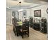 Elegant dining room with a long wooden table, chandelier, and wine storage racks at 424 Luna Bella Ln # 330, New Smyrna Beach, FL 32168