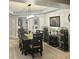 Elegant dining room with stylish furniture, modern lighting, and wine storage at 424 Luna Bella Ln # 330, New Smyrna Beach, FL 32168