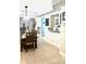 Dining area with a view to the living room, features wood flooring and contemporary furnishings at 424 Luna Bella Ln # 330, New Smyrna Beach, FL 32168