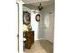 Elegant entryway with decorative mirror, wooden cabinet, and classic lighting fixtures at 424 Luna Bella Ln # 330, New Smyrna Beach, FL 32168