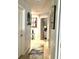 Hallway featuring neutral paint, decorative mirror, and rug at 424 Luna Bella Ln # 330, New Smyrna Beach, FL 32168
