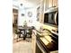 Cozy eat-in kitchen with modern appliances, stylish decor, and tile flooring at 424 Luna Bella Ln # 330, New Smyrna Beach, FL 32168