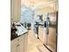 Contemporary kitchen with stainless steel appliances and eat-in breakfast nook at 424 Luna Bella Ln # 330, New Smyrna Beach, FL 32168