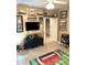 Entertainment room featuring sports memorabilia, television, and themed decor at 424 Luna Bella Ln # 330, New Smyrna Beach, FL 32168
