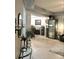 Open living room with modern decor and a wine storage area at 424 Luna Bella Ln # 330, New Smyrna Beach, FL 32168