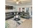 Spacious living room featuring a large grey sectional sofa at 424 Luna Bella Ln # 330, New Smyrna Beach, FL 32168