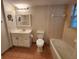 Bathroom featuring tiled shower, toilet, vanity with storage, and modern finishes at 7990 Midway Drive Ter # M103, Ocala, FL 34472