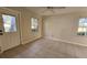 Bright room featuring tile floors, natural light, and exterior access door at 7990 Midway Drive Ter # M103, Ocala, FL 34472