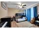 Bright bedroom with a bunk bed, blue curtains, and a plush rug, perfect for a room or guest space at 4435 Fairway Oaks Dr, Mulberry, FL 33860