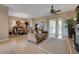 Open-concept living room flows seamlessly into the dining area, featuring sliding glass doors to the lanai at 4435 Fairway Oaks Dr, Mulberry, FL 33860