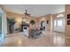 Spacious living room with tile flooring, ceiling fan and fireplace at 4435 Fairway Oaks Dr, Mulberry, FL 33860