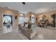 Comfortable living room featuring an adjacent dining area and abundant natural light at 4435 Fairway Oaks Dr, Mulberry, FL 33860