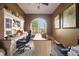 Inviting home office featuring a built-in desk, natural light, and comfortable workspace at 4435 Fairway Oaks Dr, Mulberry, FL 33860