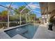 Screened pool area features a spa and inviting pool and beautiful landscaping at 4435 Fairway Oaks Dr, Mulberry, FL 33860