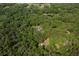 Secluded home nestled among lush greenery, offering privacy and a serene setting at 445 Se 98Th Ave, Webster, FL 33597