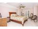 Inviting bedroom featuring a comfortable bed, ceiling fan, and French doors leading to an outdoor space at 445 Se 98Th Ave, Webster, FL 33597