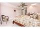 Primary bedroom featuring a ceiling fan, bed, and a wet bar at 445 Se 98Th Ave, Webster, FL 33597