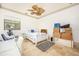 Bright bedroom with ceiling fan and comfortable bed, offering a serene and inviting atmosphere at 445 Se 98Th Ave, Webster, FL 33597