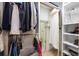Practical walk-in closet with shelving and clothing rods for efficient storage at 445 Se 98Th Ave, Webster, FL 33597