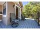 Outdoor deck offers space for entertaining and relaxation, with beautiful views of the backyard at 445 Se 98Th Ave, Webster, FL 33597