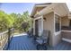 This outdoor deck features seating and space for entertaining, with beautiful backyard views at 445 Se 98Th Ave, Webster, FL 33597