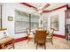Eat-in kitchen with a round table, upholstered chairs, and views of the backyard at 445 Se 98Th Ave, Webster, FL 33597