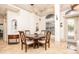 Cozy dining area with tile floors, large windows, and decorative ceiling trim at 445 Se 98Th Ave, Webster, FL 33597