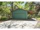 Detached garage with carport featuring ample space for parking and storage at 445 Se 98Th Ave, Webster, FL 33597
