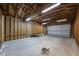 Expansive garage interior with exposed beams offering customizable potential at 445 Se 98Th Ave, Webster, FL 33597