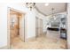 Hallway view of the bathroom with a soaking tub and a bedroom with tray ceilings at 445 Se 98Th Ave, Webster, FL 33597