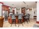 Island bar with seating for four and stainless steel appliances at 445 Se 98Th Ave, Webster, FL 33597