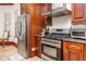 Gourmet kitchen featuring stainless steel appliances and custom cabinetry at 445 Se 98Th Ave, Webster, FL 33597