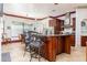 Spacious kitchen with a large center island, stainless steel appliances, and eat-in dining area at 445 Se 98Th Ave, Webster, FL 33597