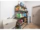 Practical laundry room includes utility sink, shelving, and durable tile flooring at 445 Se 98Th Ave, Webster, FL 33597
